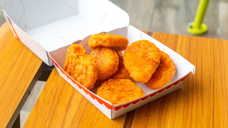 An open box of McDonald's chicken McNuggets on a table