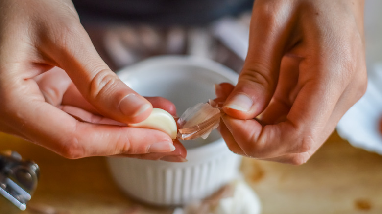 peeling garlic clove