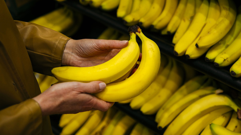 Someone looking at bananas