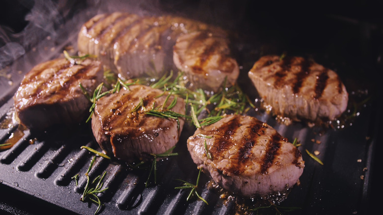 Meat cooking on an electric grill