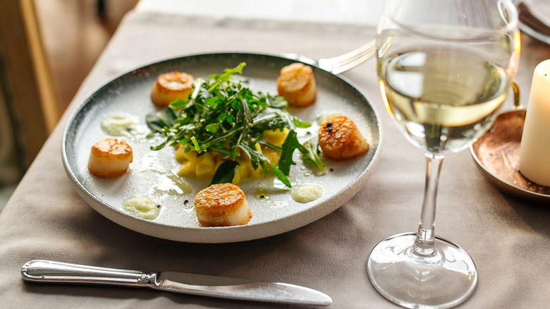 plated scallops and white wine