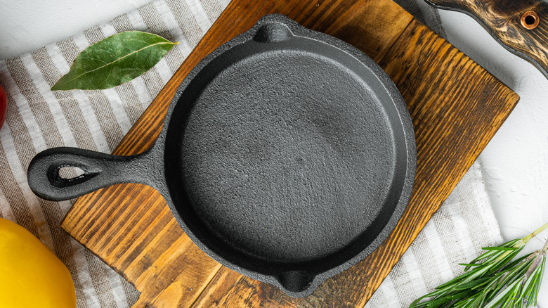 Cast iron skillet on wood board