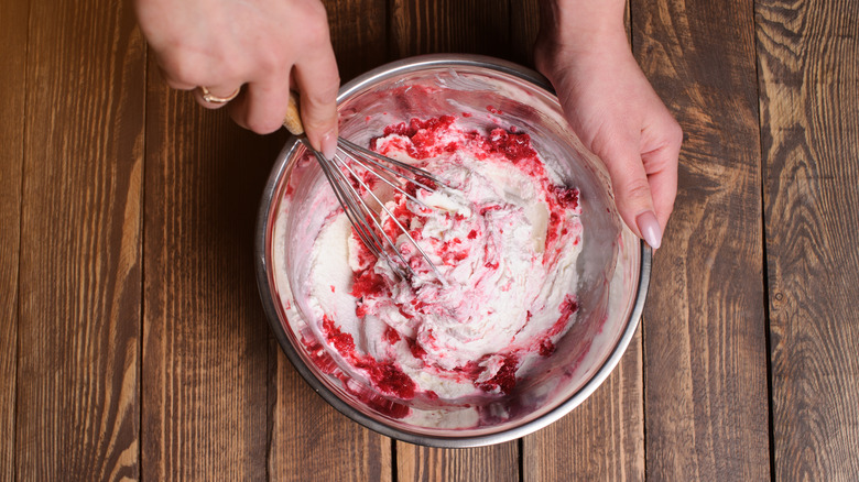 Mixing berries into ice cream