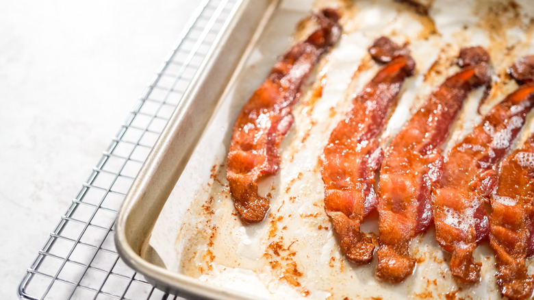 Cooked bacon on baking sheet