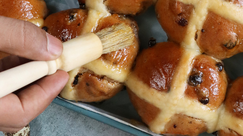 Person brushing pastries