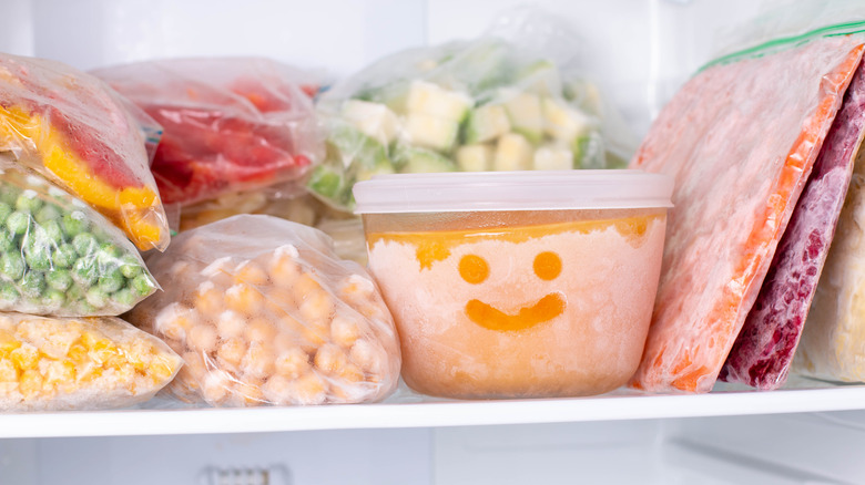 Frozen soup container in freezer with smile