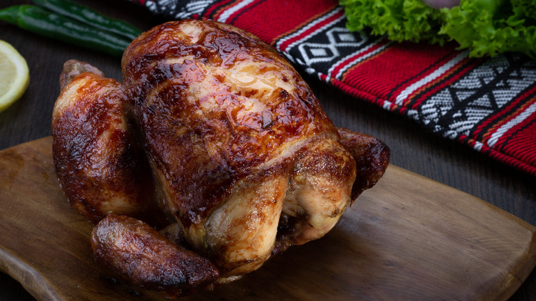 rotisserie chicken on a cutting board