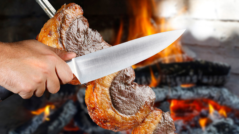 Skewered meat and knife 