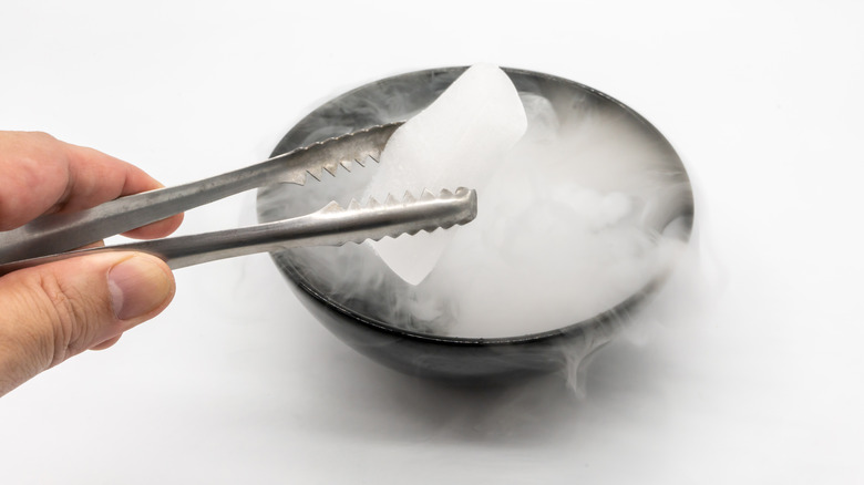 handling dry ice with tweezers