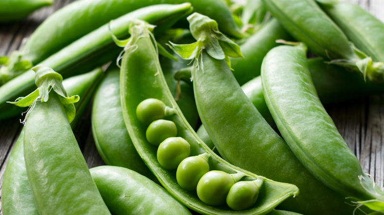 Snap peas on a board