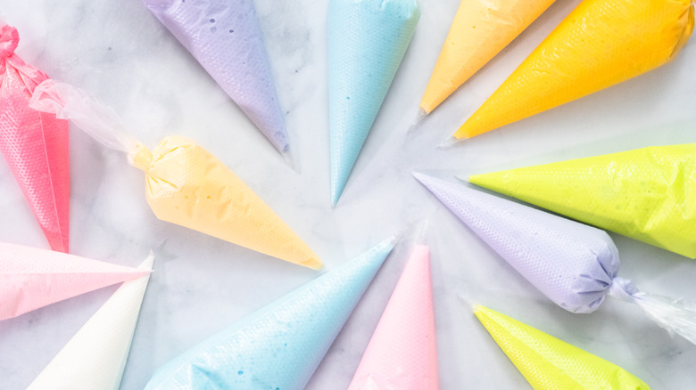 Multicolored bags of royal icing