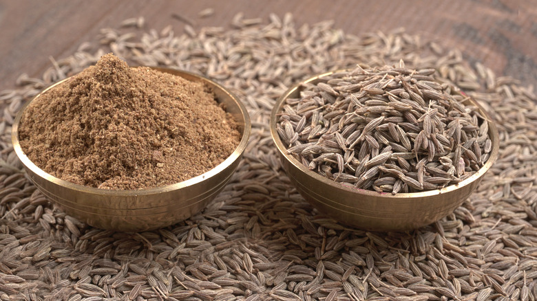 bowls of whole and ground cumin