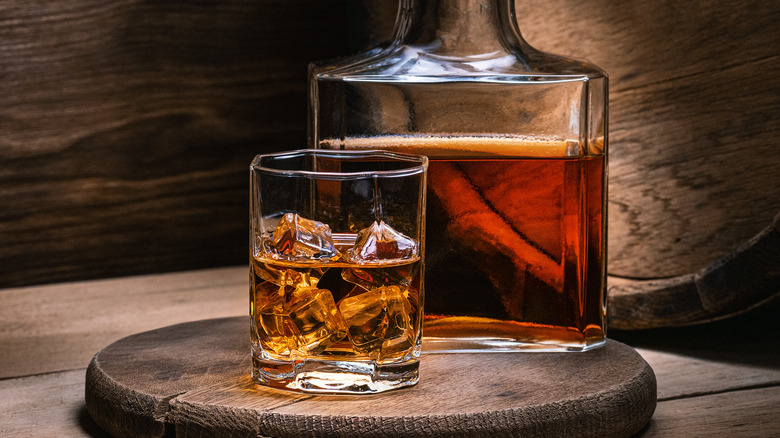lowball and decanter of whiskey