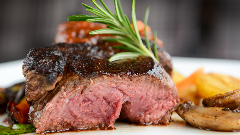 Steak on plate with vegetables
