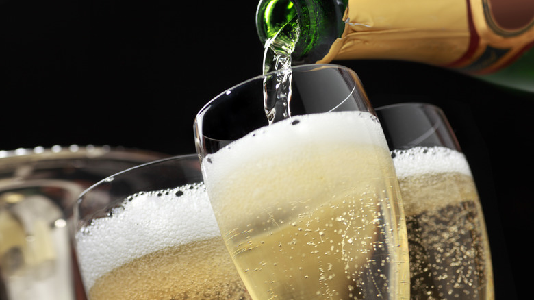 champagne pouring into glasses
