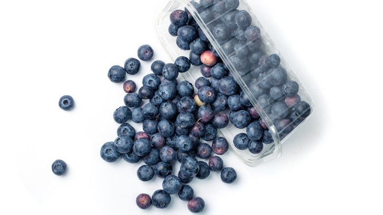 berries spilling out of container