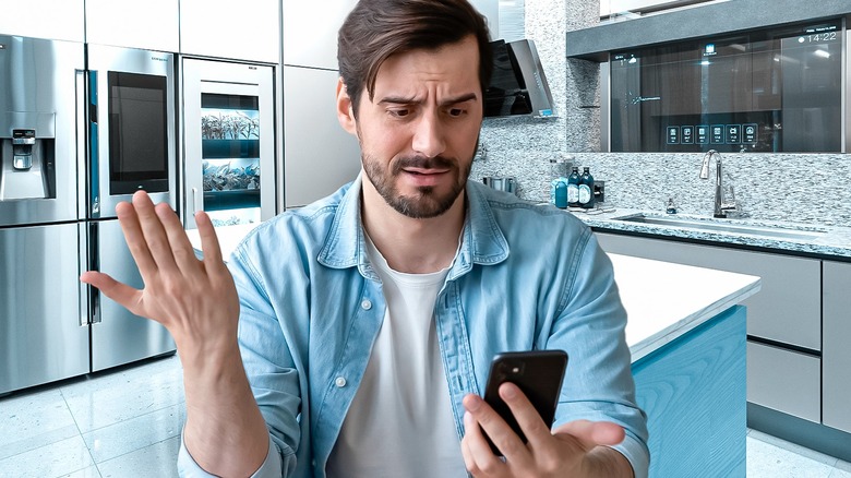 Person using IoT in kitchen