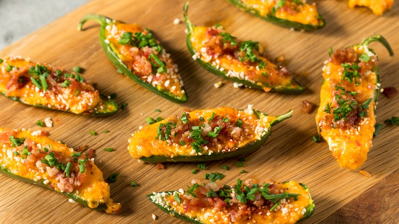 jalapeño poppers on cutting board