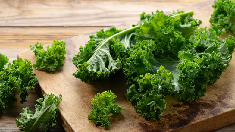Kale on wood cutting board