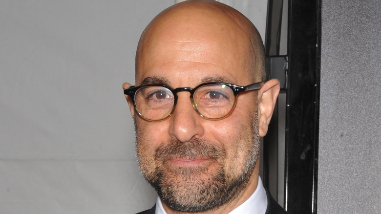 Stanley Tucci smirking at camera