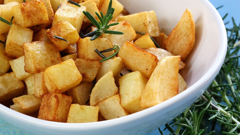roasted potatoes in white bowl