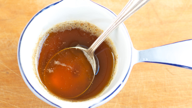 Brown butter in a bowl with a spoon