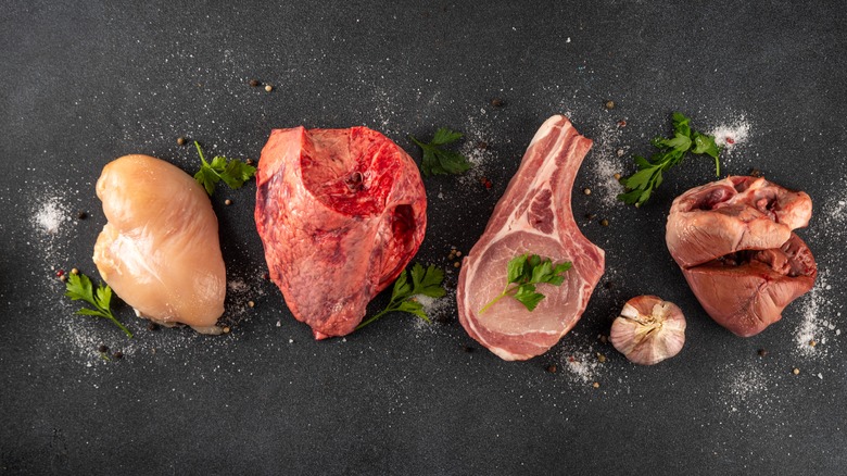 A variety of protein sources on a black counter