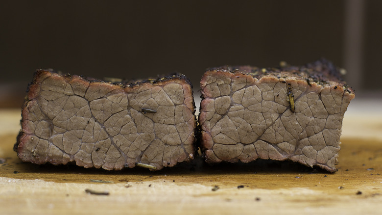 Inside a well-done steak on a cutting board
