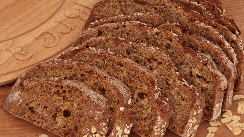 Sliced loaf of brown bread
