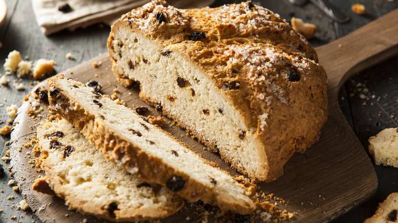 Sliced Irish soda bread on wood board