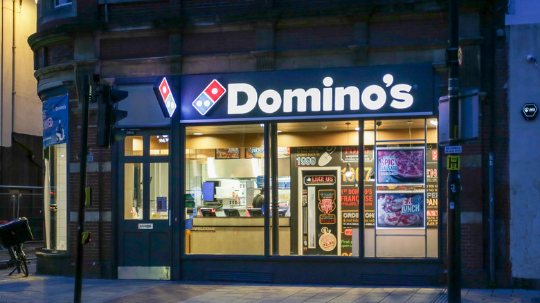 Exterior of a Domino's at night