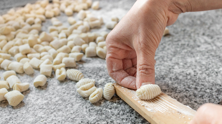 A person making gnocchi