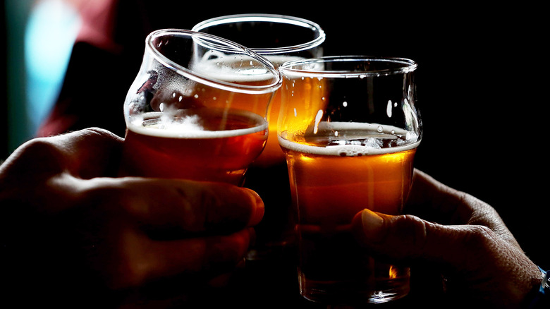 3 friends cheer beers