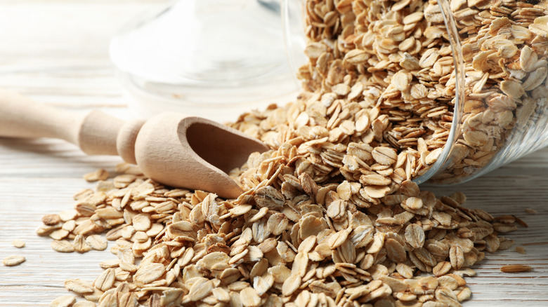 A glass jar with dry oats 