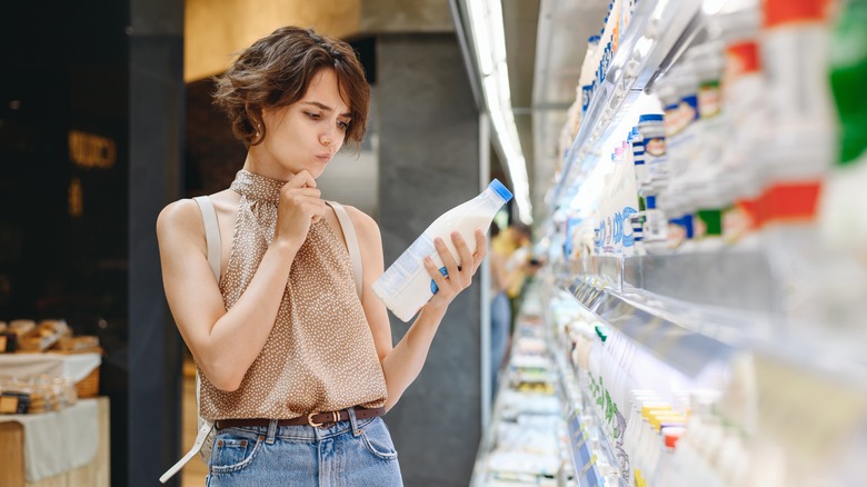 Woman shopping for milk 