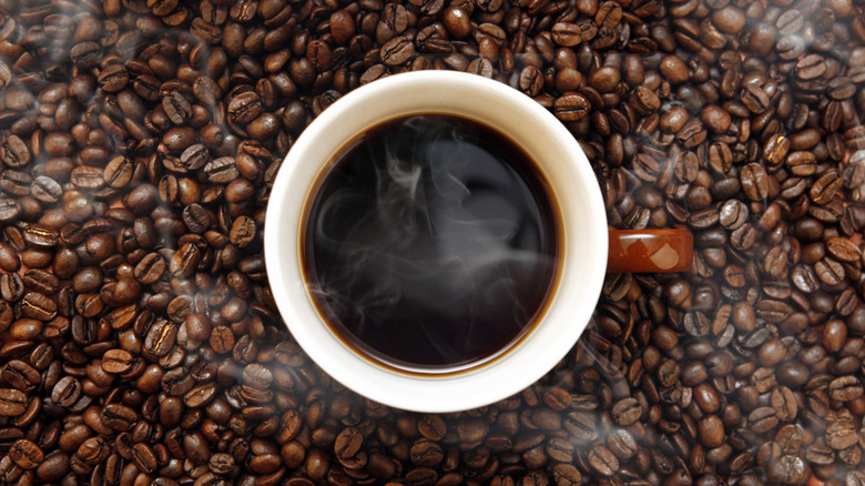 cup of coffee and coffee beans