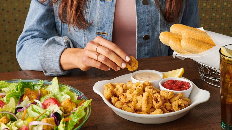 woman eating appetizers at Olive Garden