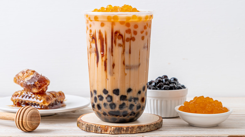 boba tea with black and orange pearls