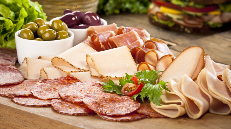 charcuterie board with sliced meats
