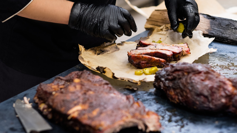Chef cooking smoked pork ribs 