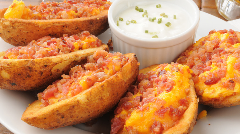 Potato skins covered in bacon bits 