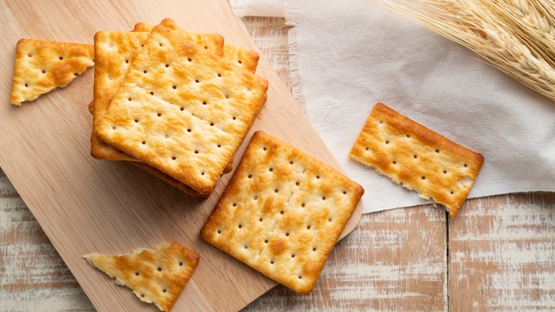 Crackers on wooden board