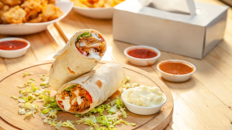 burrito on a wooden plate
