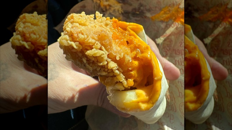 Person holding a KFC wrap