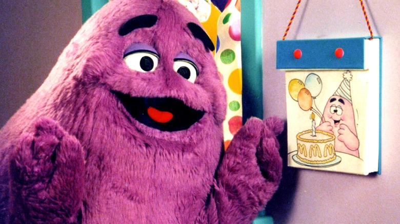 Grimace smiling with birthday drawing