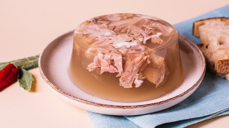 White clay plate with meat Jell-o mold