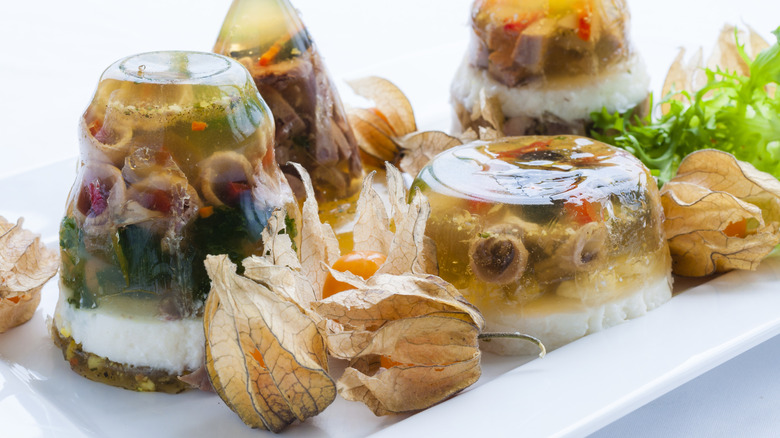 Savory aspic gelatin molds on white table