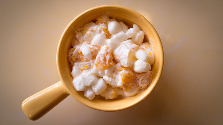 Small clay pot with mandarin and marshmallow Jell-o salad