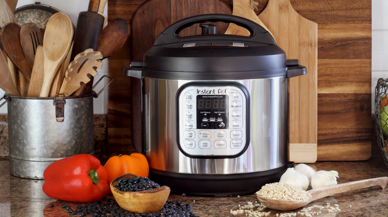 Instant pot with rice, beans, and tomatoes