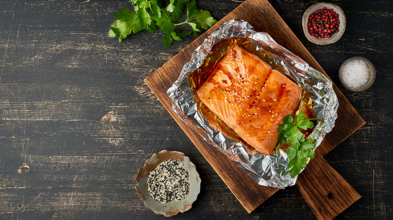 Salmon with parsley on foil